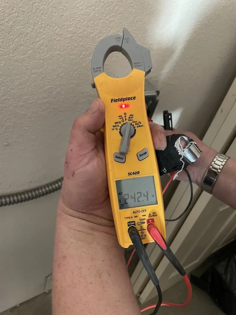 Voltage testing with clamp meter during Outlet Installation in Inman